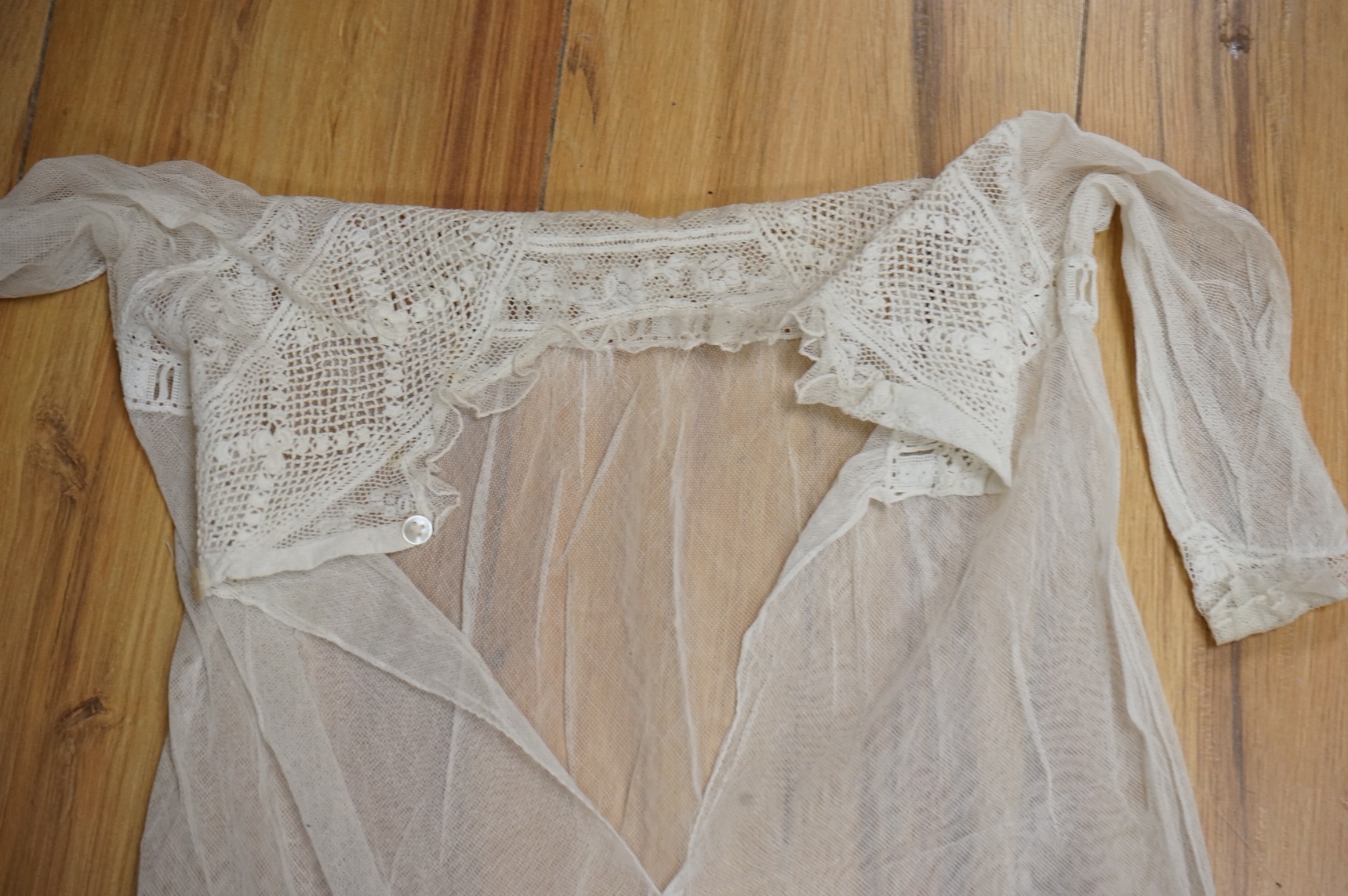 A collection Victorian textiles to include a lace christening gown, Irish crochet and a net baby gown